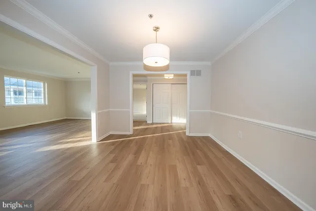 a kitchen with a refrigerator sink and cabinets