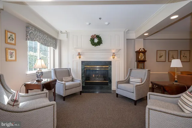 a dining room with a wooden table and chairs