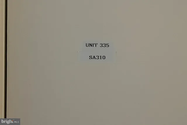 a view of a garden with a building in the background