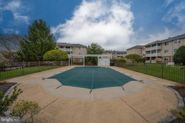 a view of a park with large trees