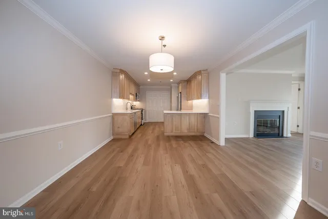 a kitchen with a refrigerator and a sink