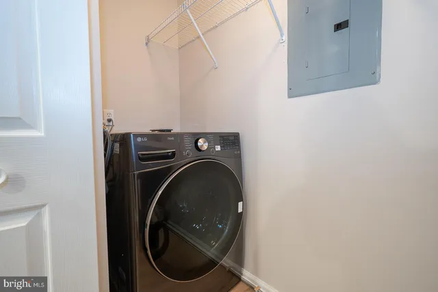 a large kitchen with stainless steel appliances sink a microwave and cabinets