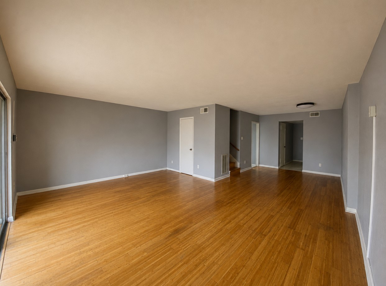 7913 Grove Ridge Drive Houston, TX 77061 - Photo 6 of 24 Open-plan living and dining area with warm wood flooring