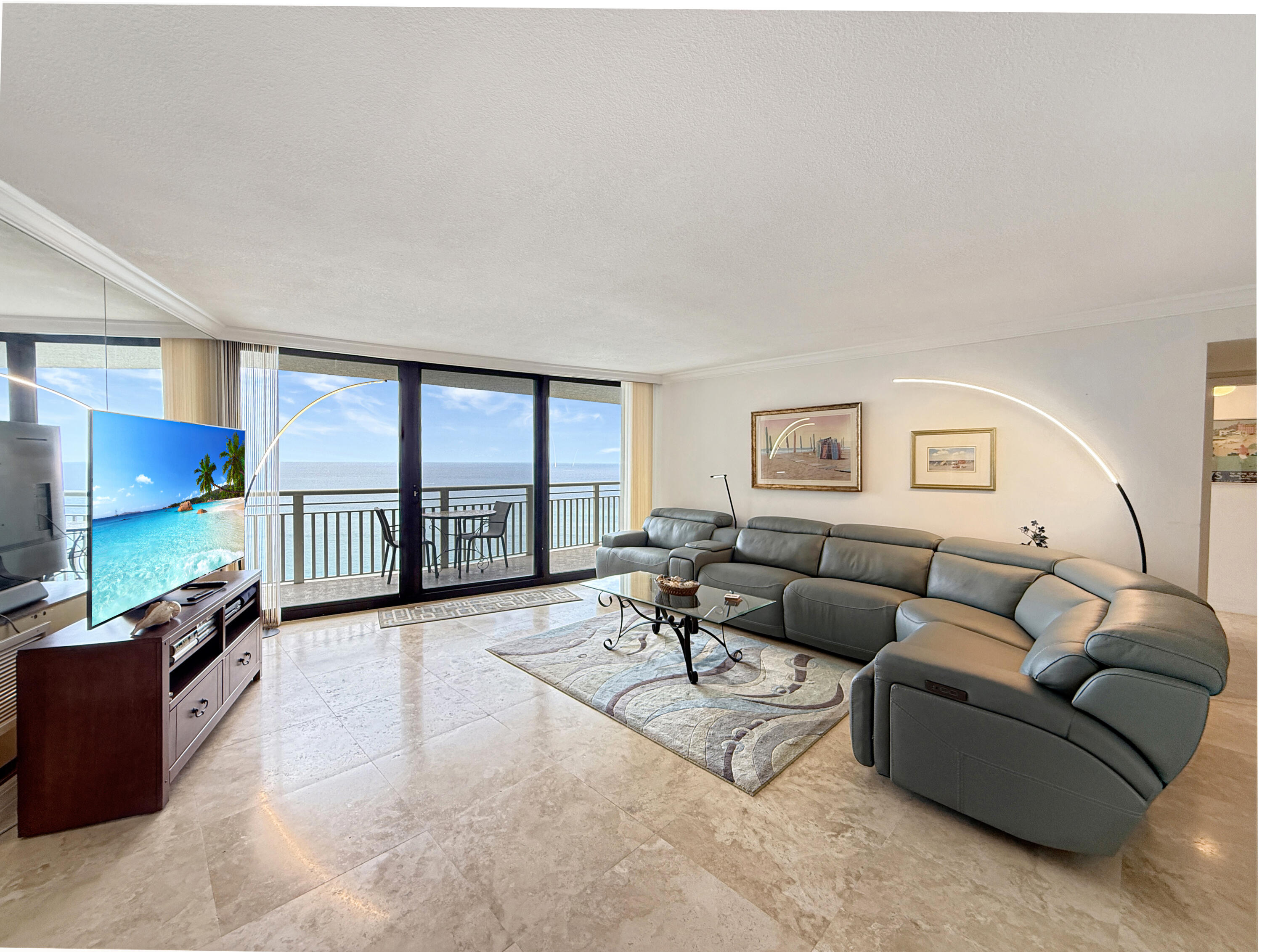 3000 North Ocean Drive, Unit 40E Riviera Beach, FL 33404 - Photo 2 of 50 a living room with furniture tv and a flat screen tv