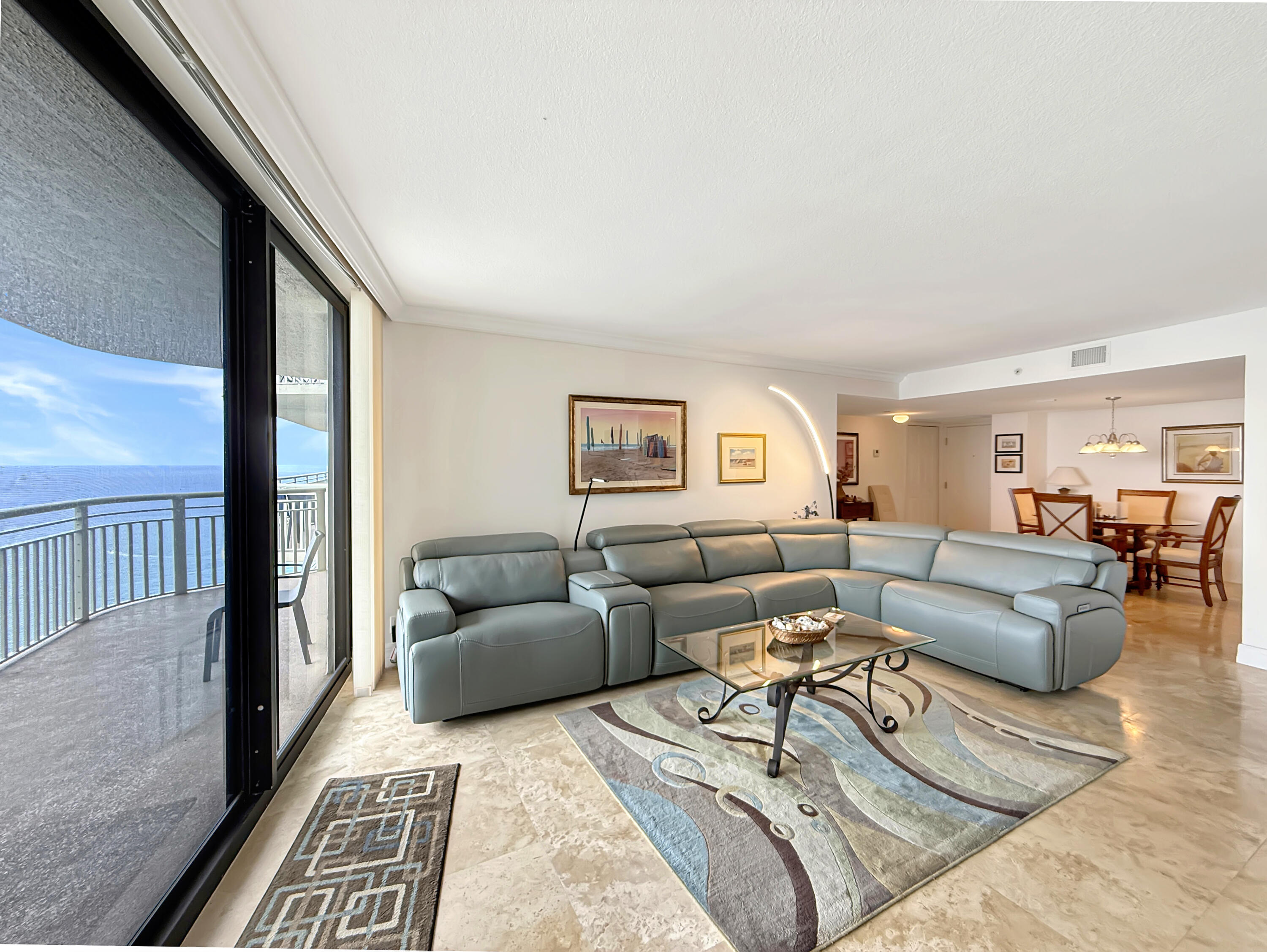 3000 North Ocean Drive, Unit 40E Riviera Beach, FL 33404 - Photo 3 of 50 a living room with furniture and a couch