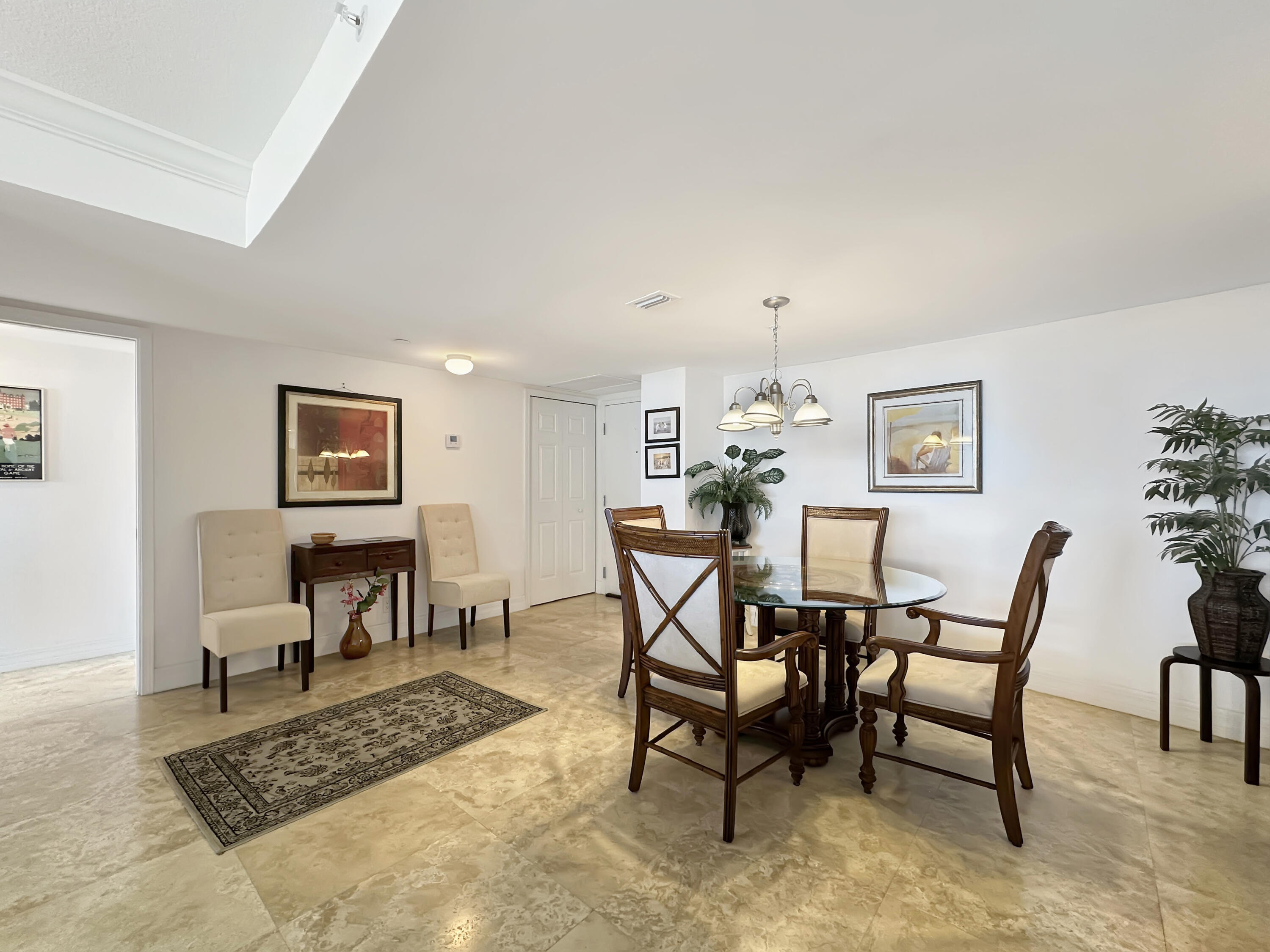 3000 North Ocean Drive, Unit 40E Riviera Beach, FL 33404 - Photo 4 of 50 a dining room with furniture and a rug