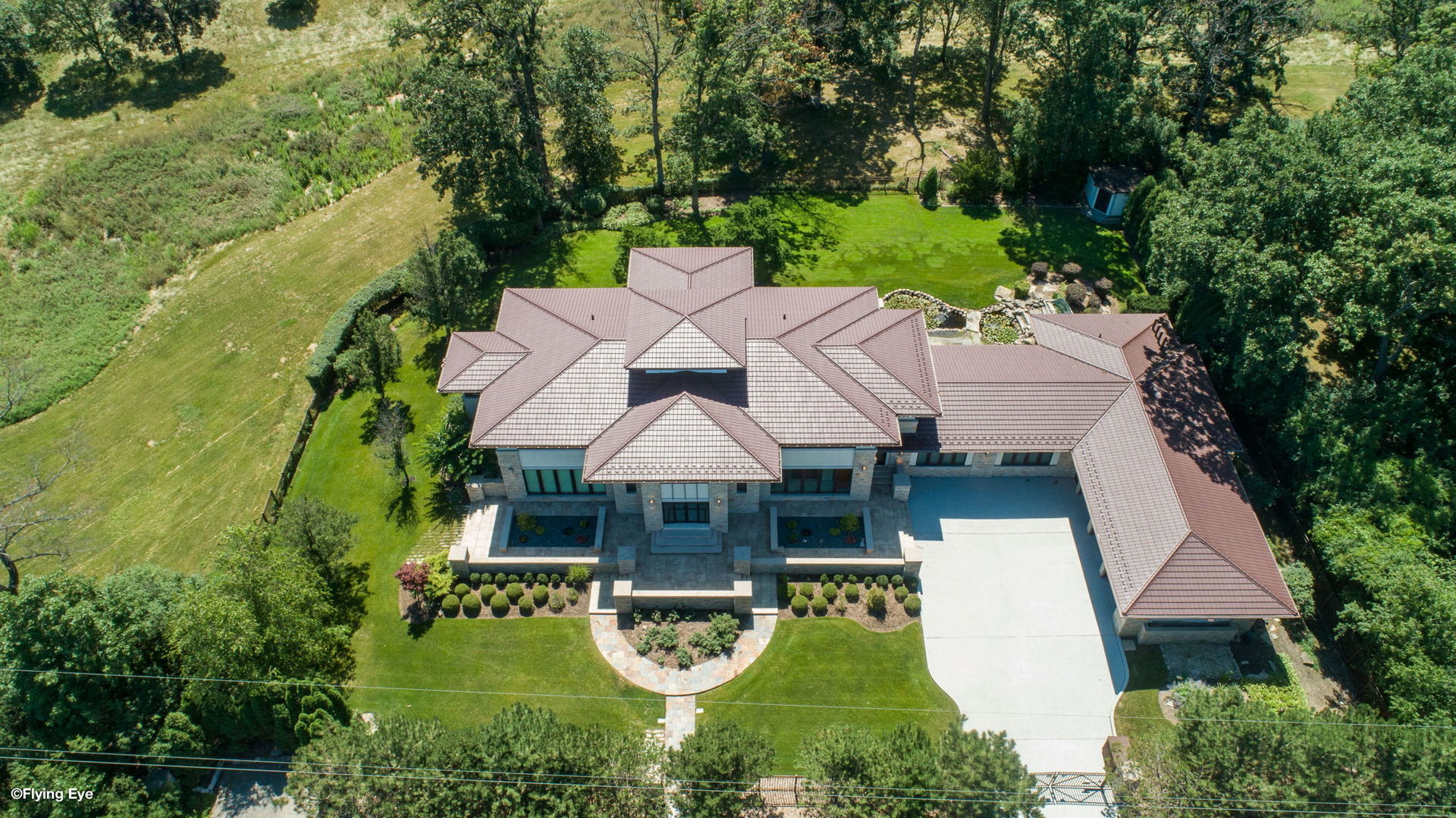 925 Morrison Road Northbrook, IL 60062 - Photo 4 of 75 an aerial view of a house with swimming pool and lake view