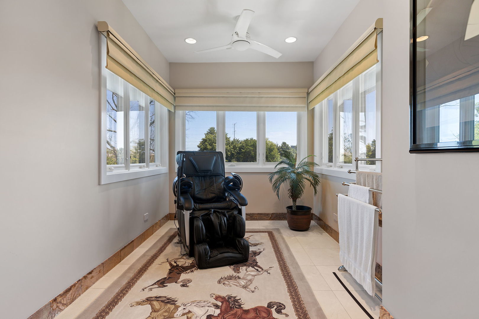 925 Morrison Road Northbrook, IL 60062 - Photo 52 of 75 a room with furniture a large window and gym equipment