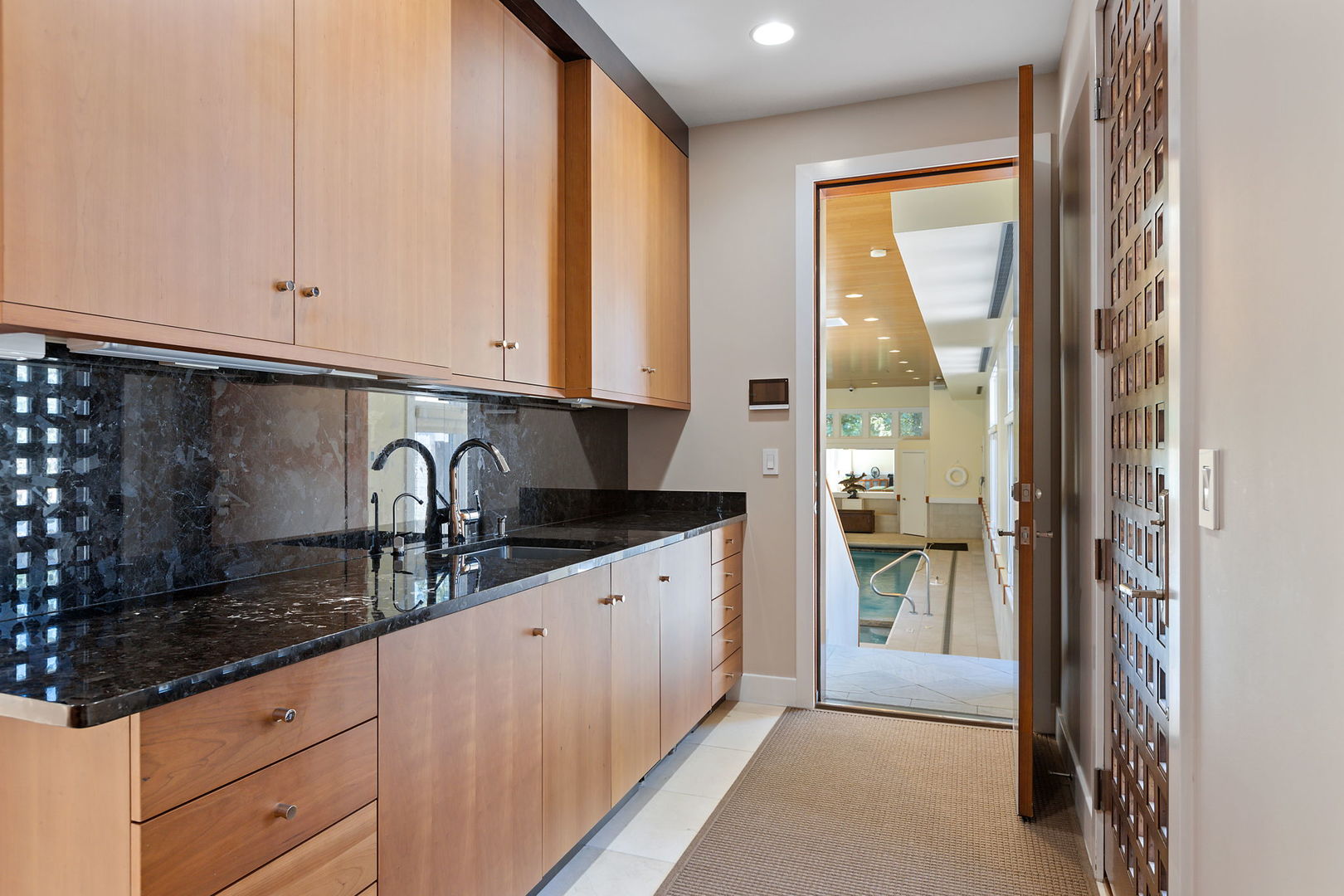 925 Morrison Road Northbrook, IL 60062 - Photo 63 of 75 a kitchen with granite countertop a sink and white cabinets
