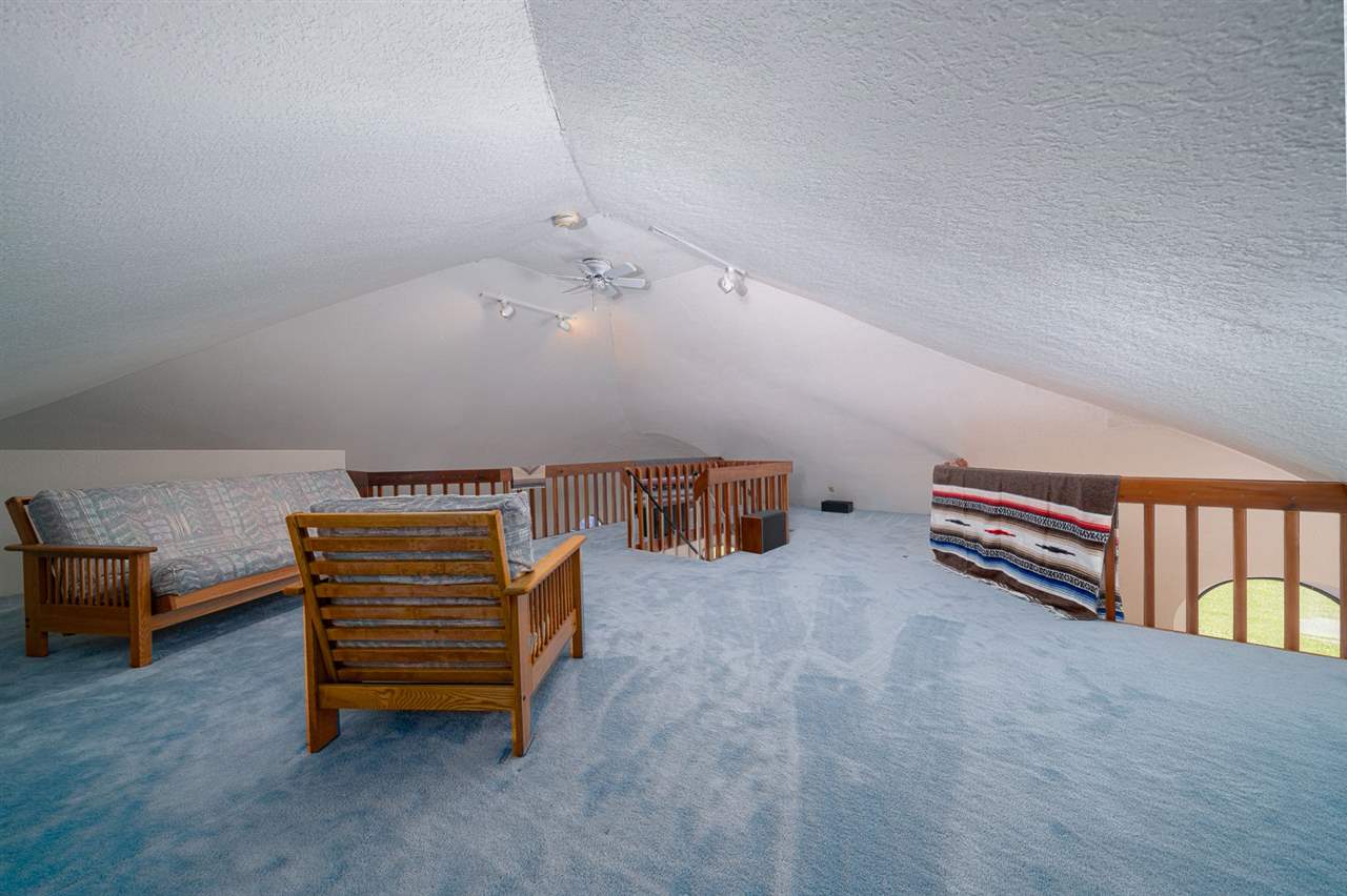 208 New Forest Road Southwest Poplar Grove, IL 61065 - Photo 12 of 40 a room with stairs and a chair