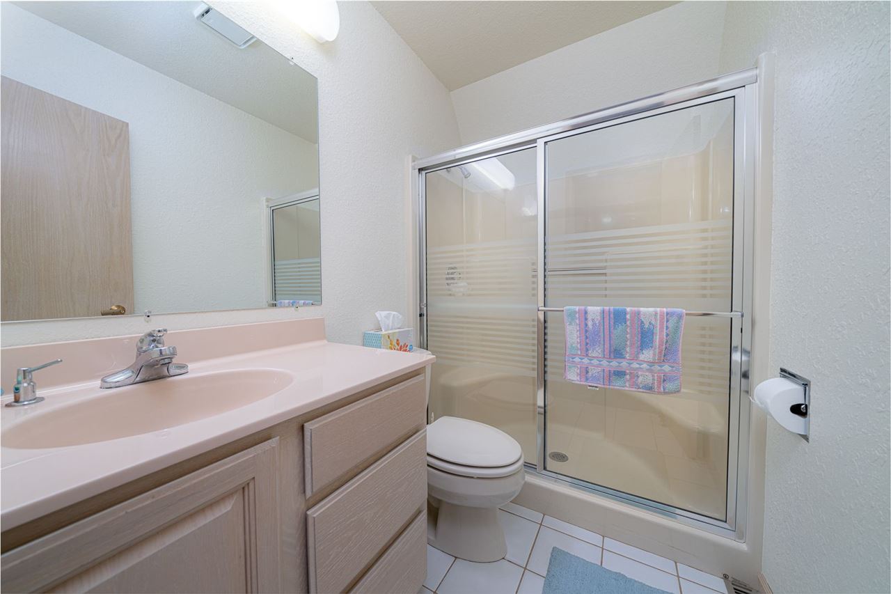 208 New Forest Road Southwest Poplar Grove, IL 61065 - Photo 19 of 40 a bathroom with a sink a toilet and shower