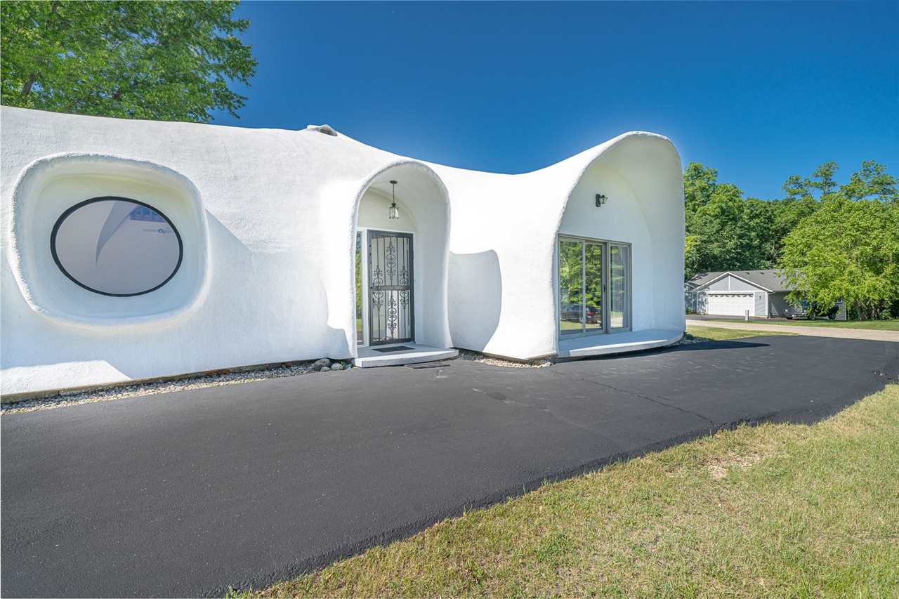 208 New Forest Road Southwest Poplar Grove, IL 61065 - Photo 2 of 40 a view of entrance gate and small garden
