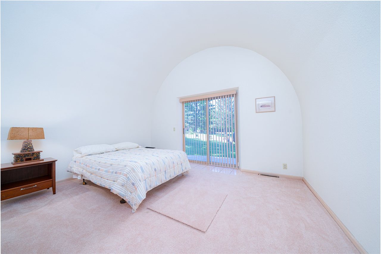 208 New Forest Road Southwest Poplar Grove, IL 61065 - Photo 22 of 40 a spacious bedroom with a bed and a table