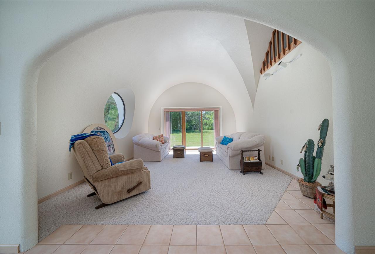 208 New Forest Road Southwest Poplar Grove, IL 61065 - Photo 5 of 40 a living room with furniture and a large window