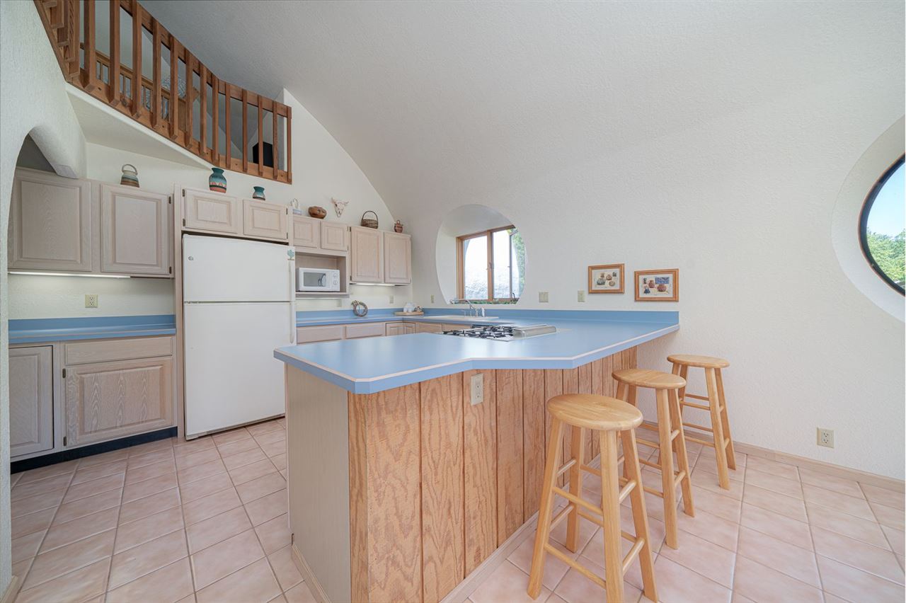 208 New Forest Road Southwest Poplar Grove, IL 61065 - Photo 7 of 40 a kitchen with stainless steel appliances granite countertop a sink and a refrigerator