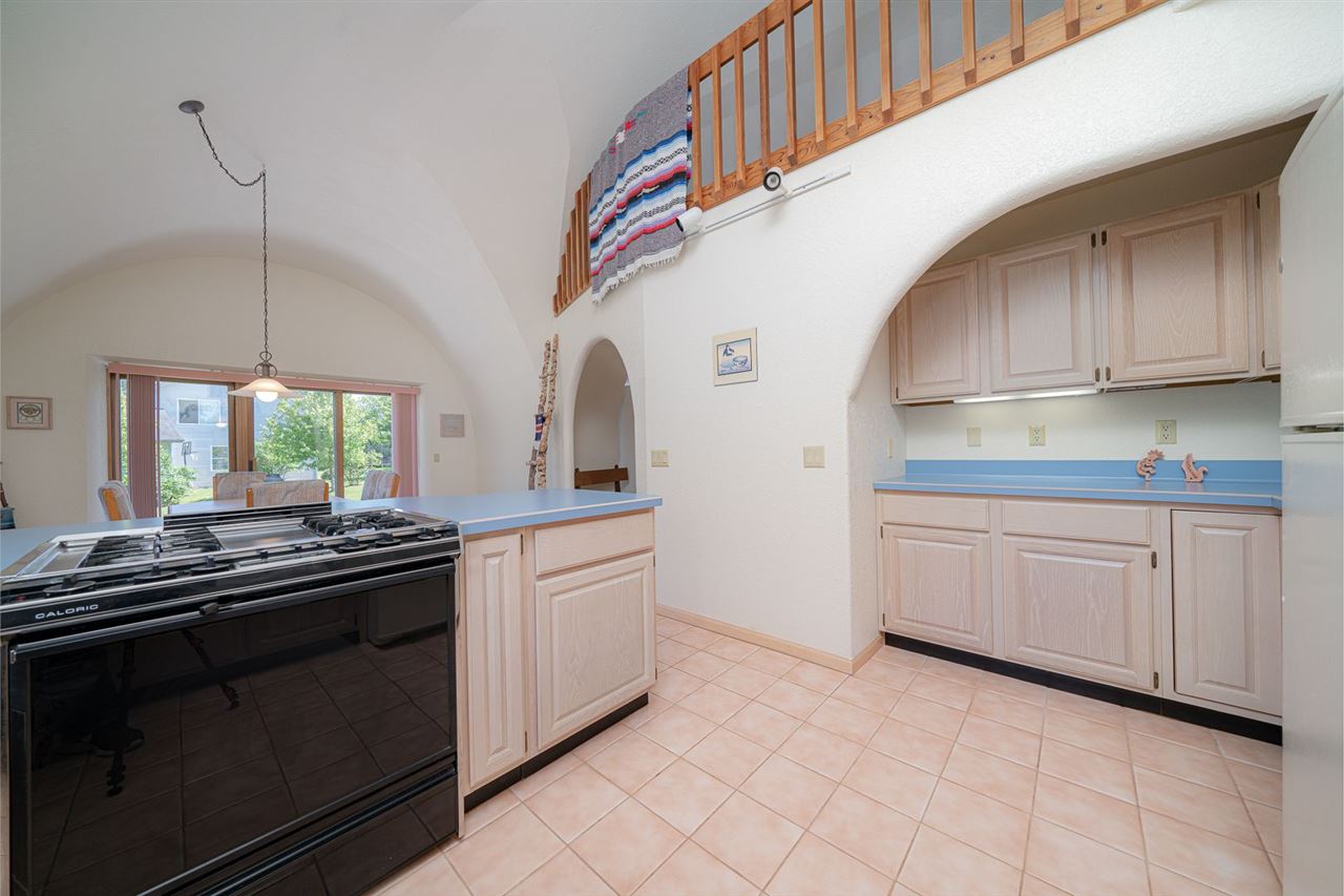 208 New Forest Road Southwest Poplar Grove, IL 61065 - Photo 9 of 40 a kitchen with stainless steel appliances granite countertop a sink and cabinets