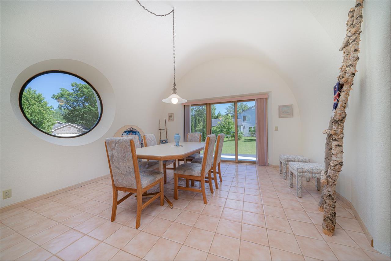 208 New Forest Road Southwest Poplar Grove, IL 61065 - Photo 10 of 40 a dining room with furniture and a floor to ceiling window