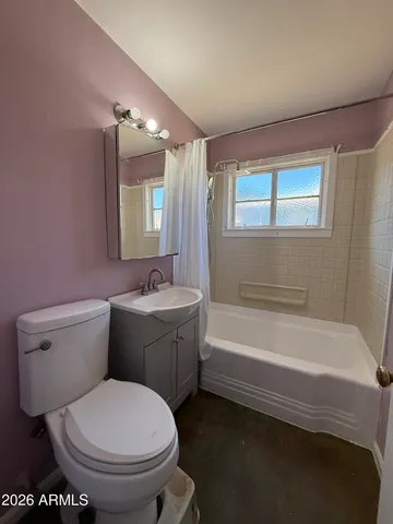 a bathroom with a sink toilet and bathtub