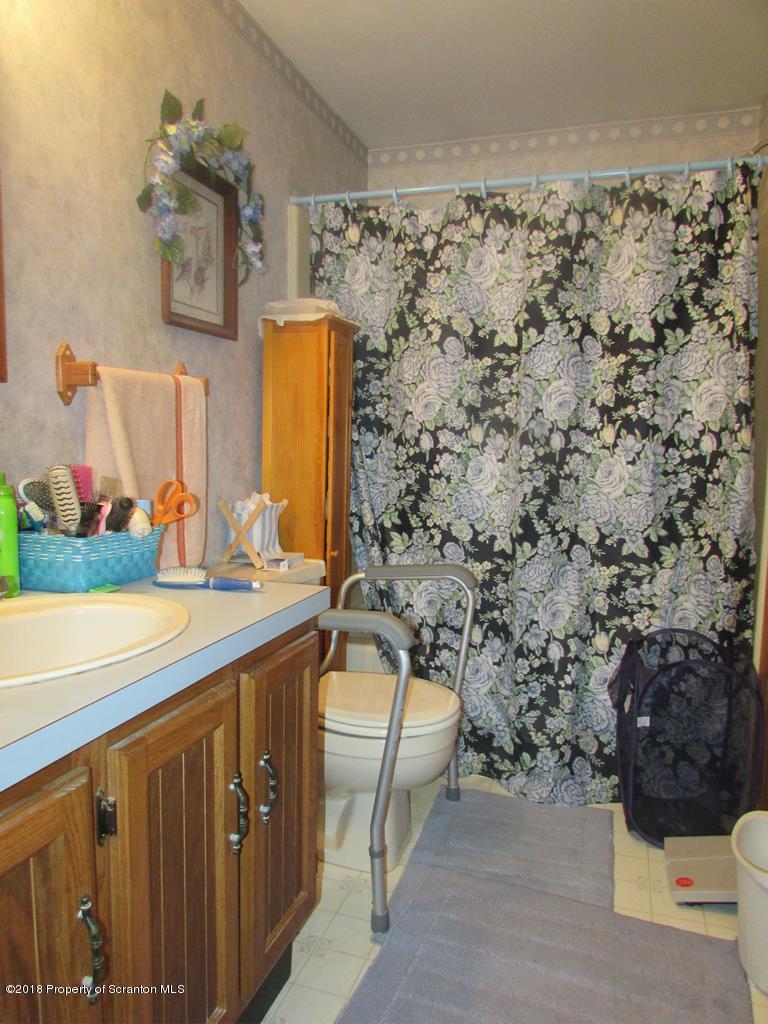 91 Turkey Path Road Wyalusing, PA 18853 - Photo 11 of 22 a bathroom with a sink and a mirror