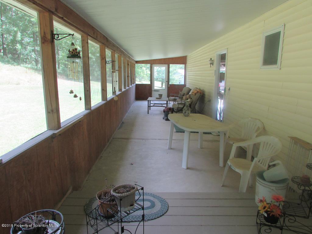 91 Turkey Path Road Wyalusing, PA 18853 - Photo 20 of 22 a lobby with furniture and floor to ceiling window