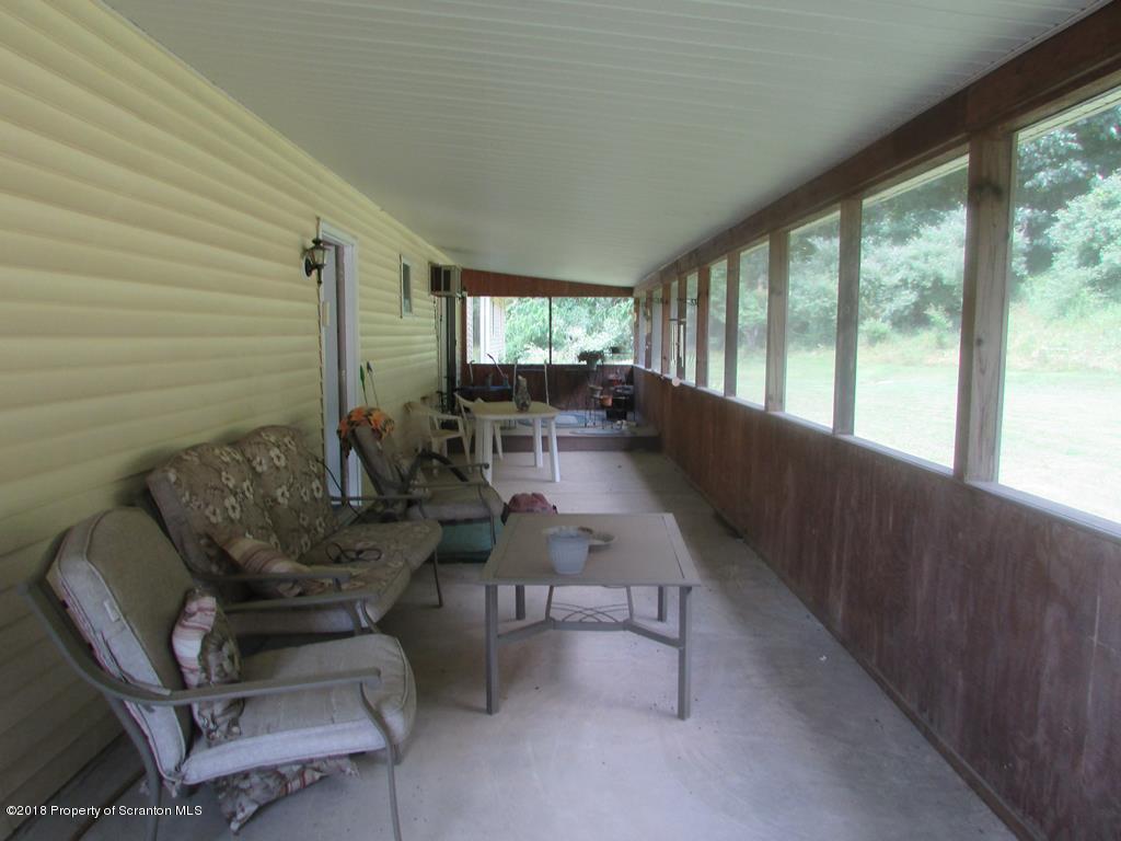 91 Turkey Path Road Wyalusing, PA 18853 - Photo 21 of 22 a living room with furniture and a large window