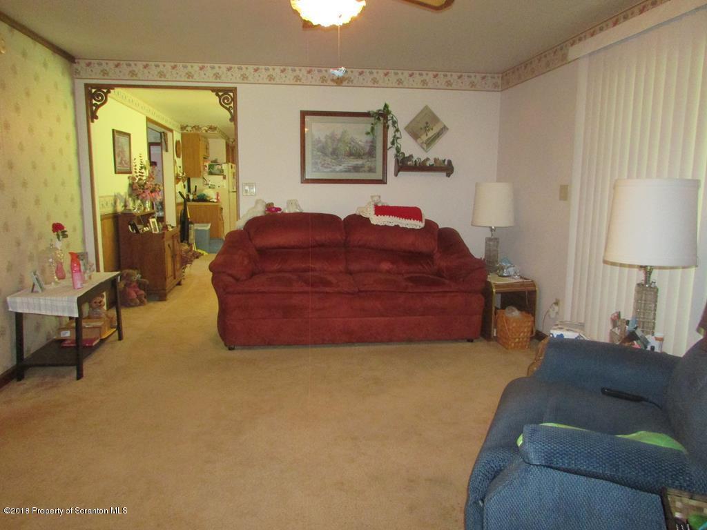 91 Turkey Path Road Wyalusing, PA 18853 - Photo 6 of 22 a living room with a bed furniture and a window