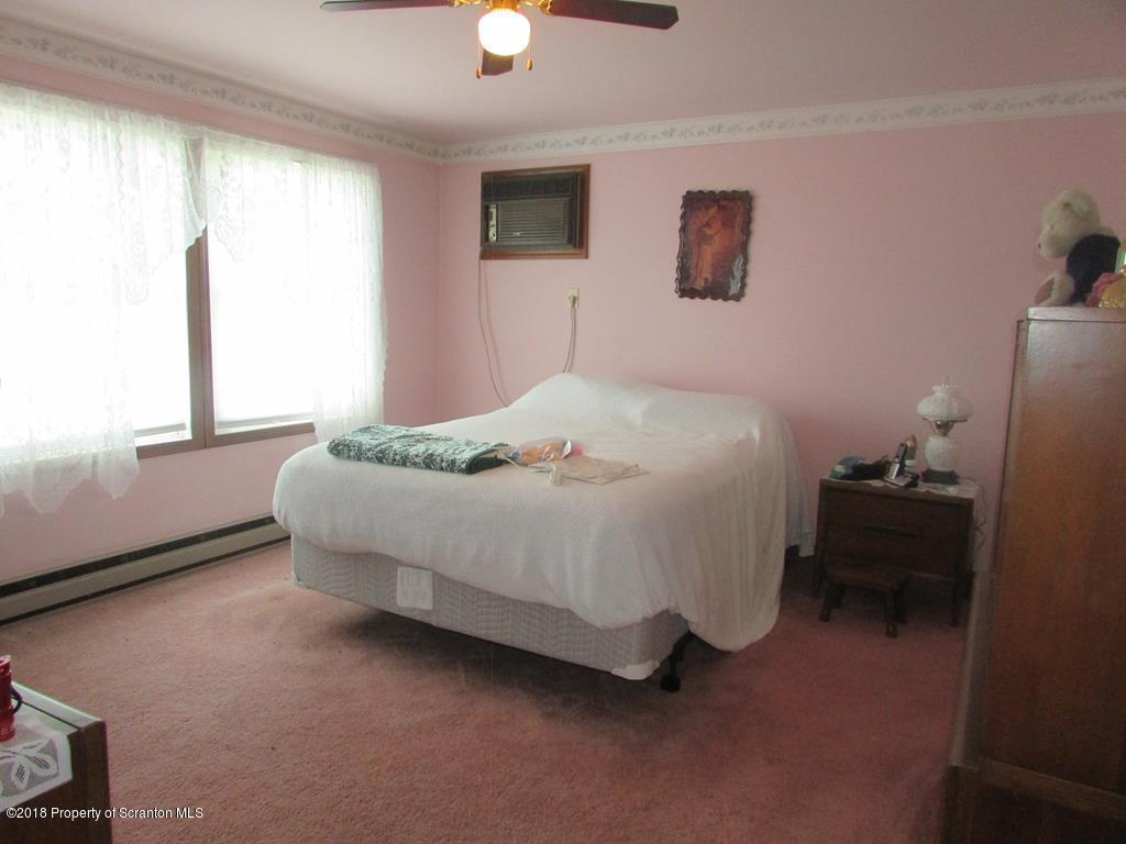 91 Turkey Path Road Wyalusing, PA 18853 - Photo 7 of 22 a bedroom with a bed and a window