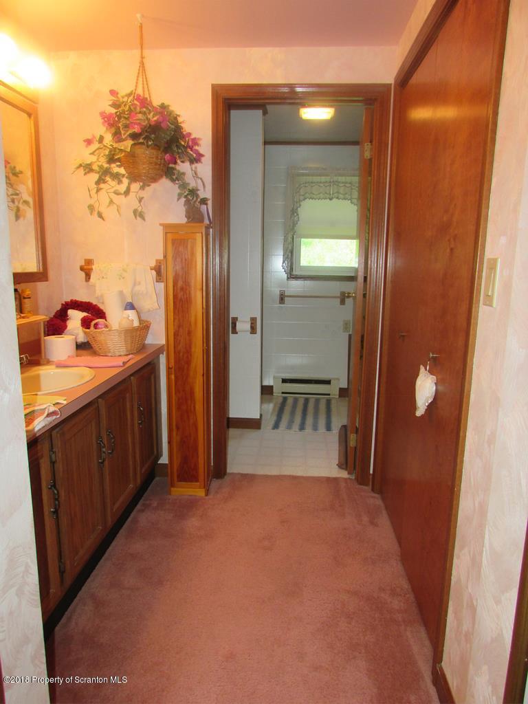 91 Turkey Path Road Wyalusing, PA 18853 - Photo 8 of 22 a bathroom with a sink and mirror