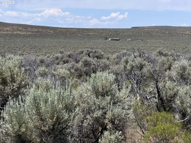 an aerial view of residential houses and outdoor space