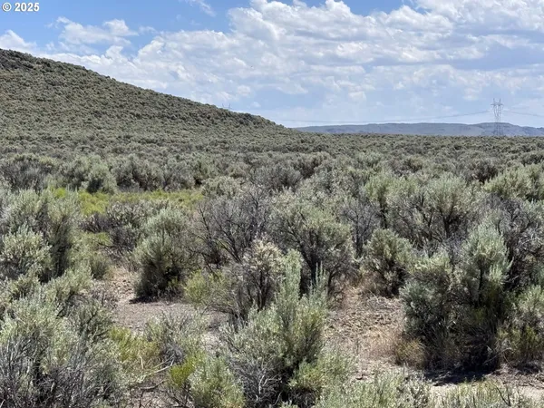a view of a field with an outdoor space