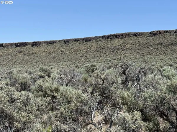 a picture of a bathroom with a shower and a sink