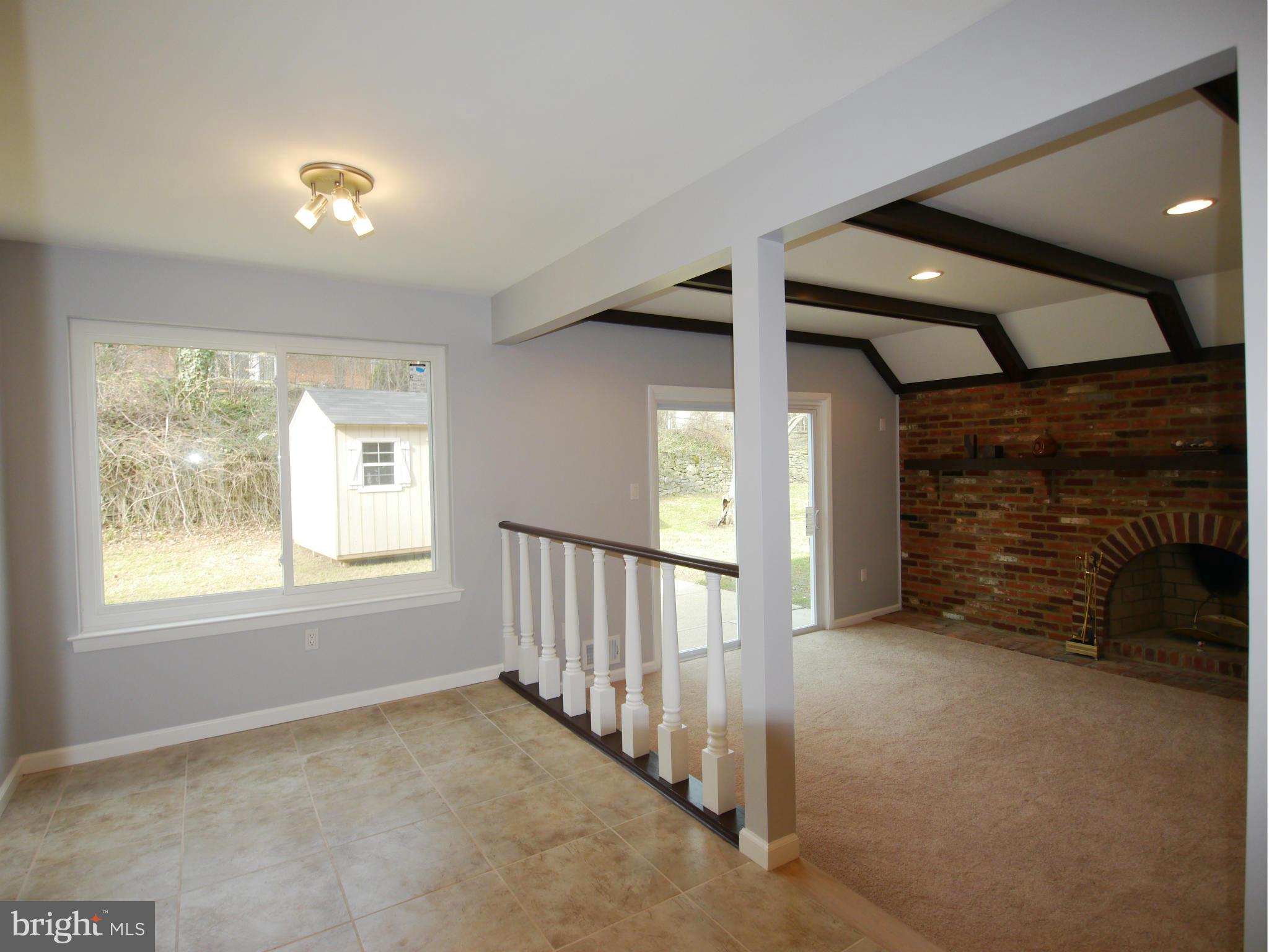 13100 Middlevale Lane Silver Spring, MD 20906 - Photo 12 of 30 a view of an empty room with a fireplace