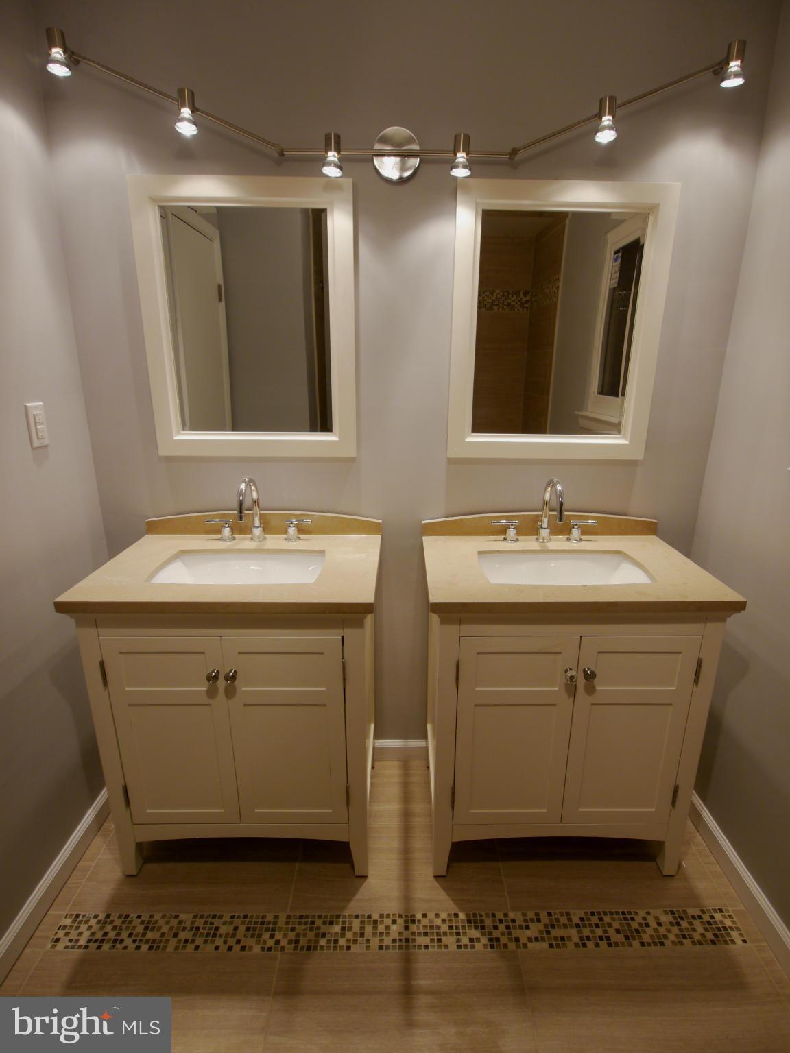 13100 Middlevale Lane Silver Spring, MD 20906 - Photo 21 of 30 a bathroom with a sink vanity and mirror