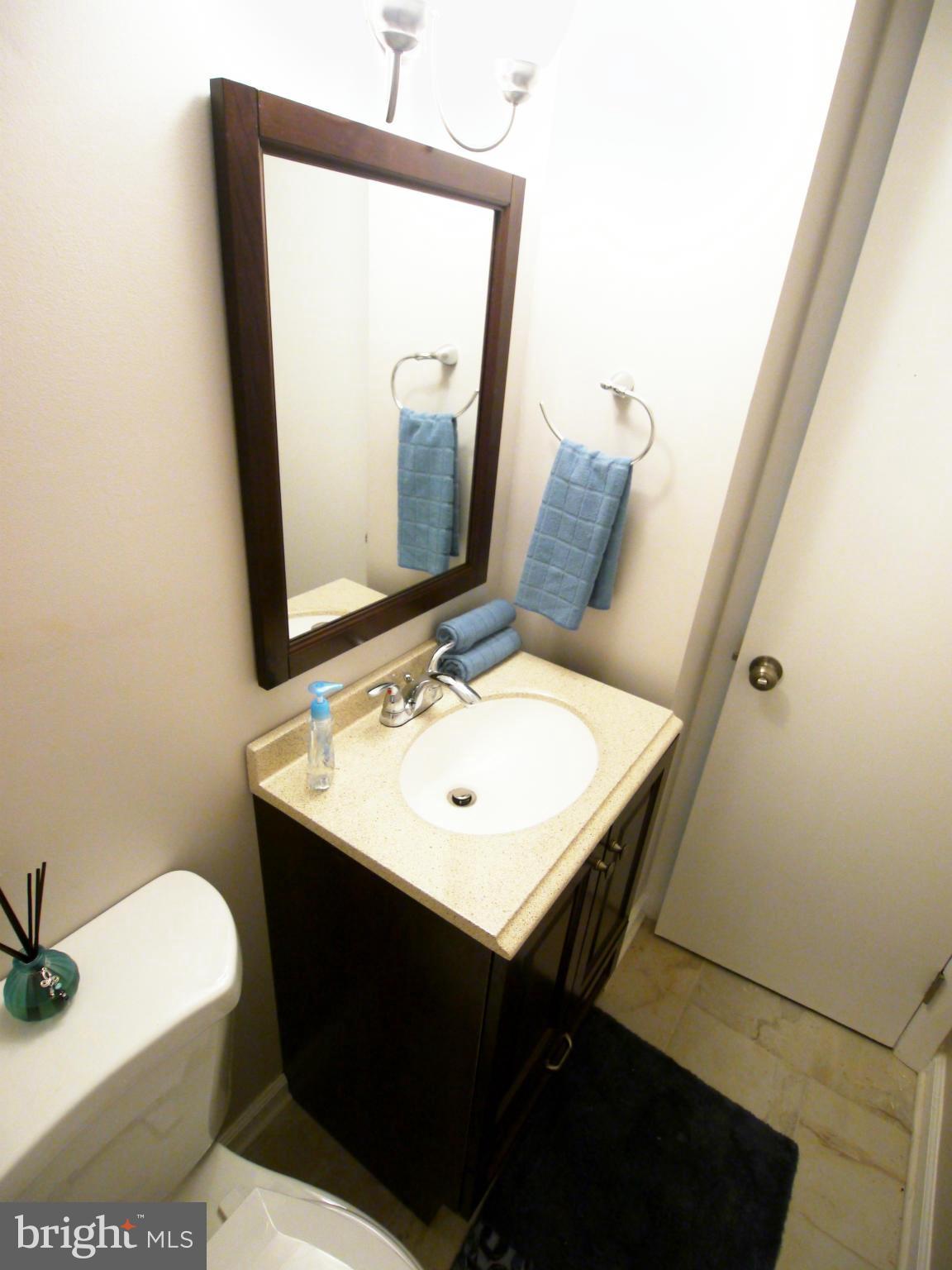 13100 Middlevale Lane Silver Spring, MD 20906 - Photo 29 of 30 a bathroom with a toilet sink and mirror