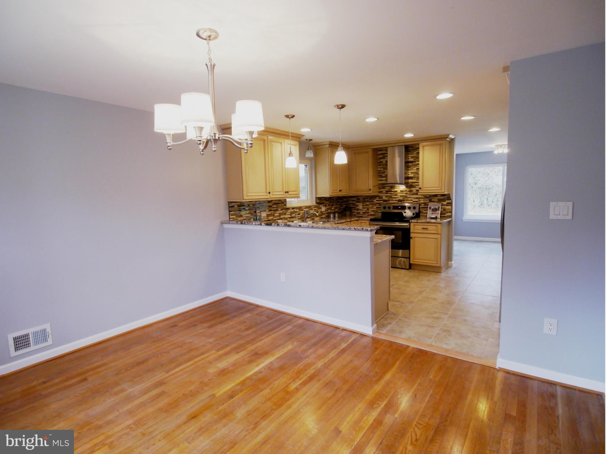 13100 Middlevale Lane Silver Spring, MD 20906 - Photo 10 of 30 a view of a kitchen with a sink and microwave