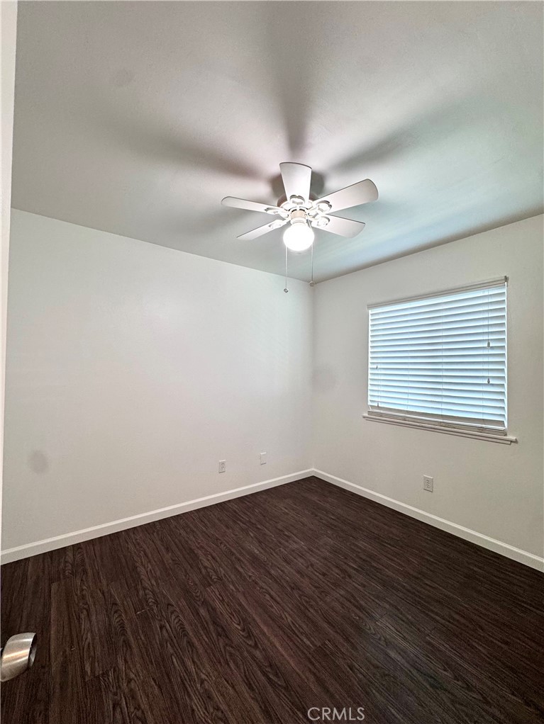 4692 Heil Avenue Huntington Beach, CA 92649 - Photo 13 of 27 a view of a room with wooden floor and fan