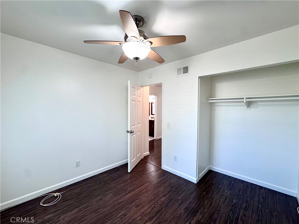 4692 Heil Avenue Huntington Beach, CA 92649 - Photo 17 of 27 a view of an empty room with wooden floor