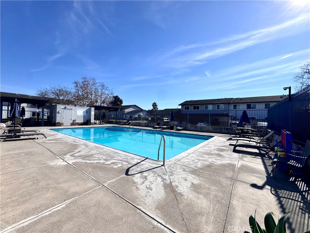 4692 Heil Avenue Huntington Beach, CA 92649 - Photo 24 of 27 a view of a swimming pool and lounge chairs