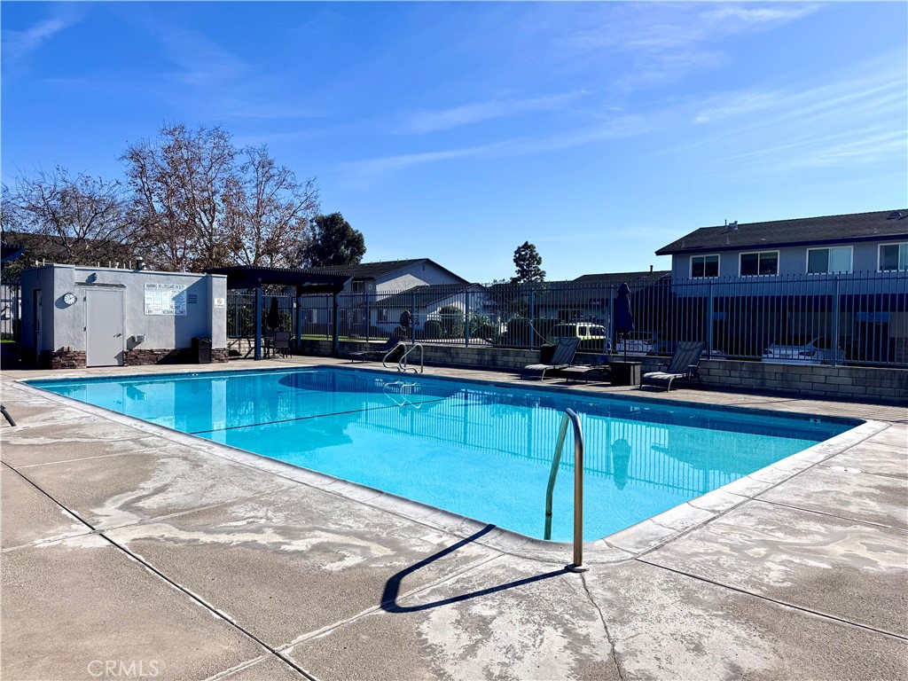 4692 Heil Avenue Huntington Beach, CA 92649 - Photo 25 of 27 a view of a swimming pool with two chairs