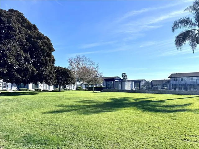 a view of a swimming pool with a yard