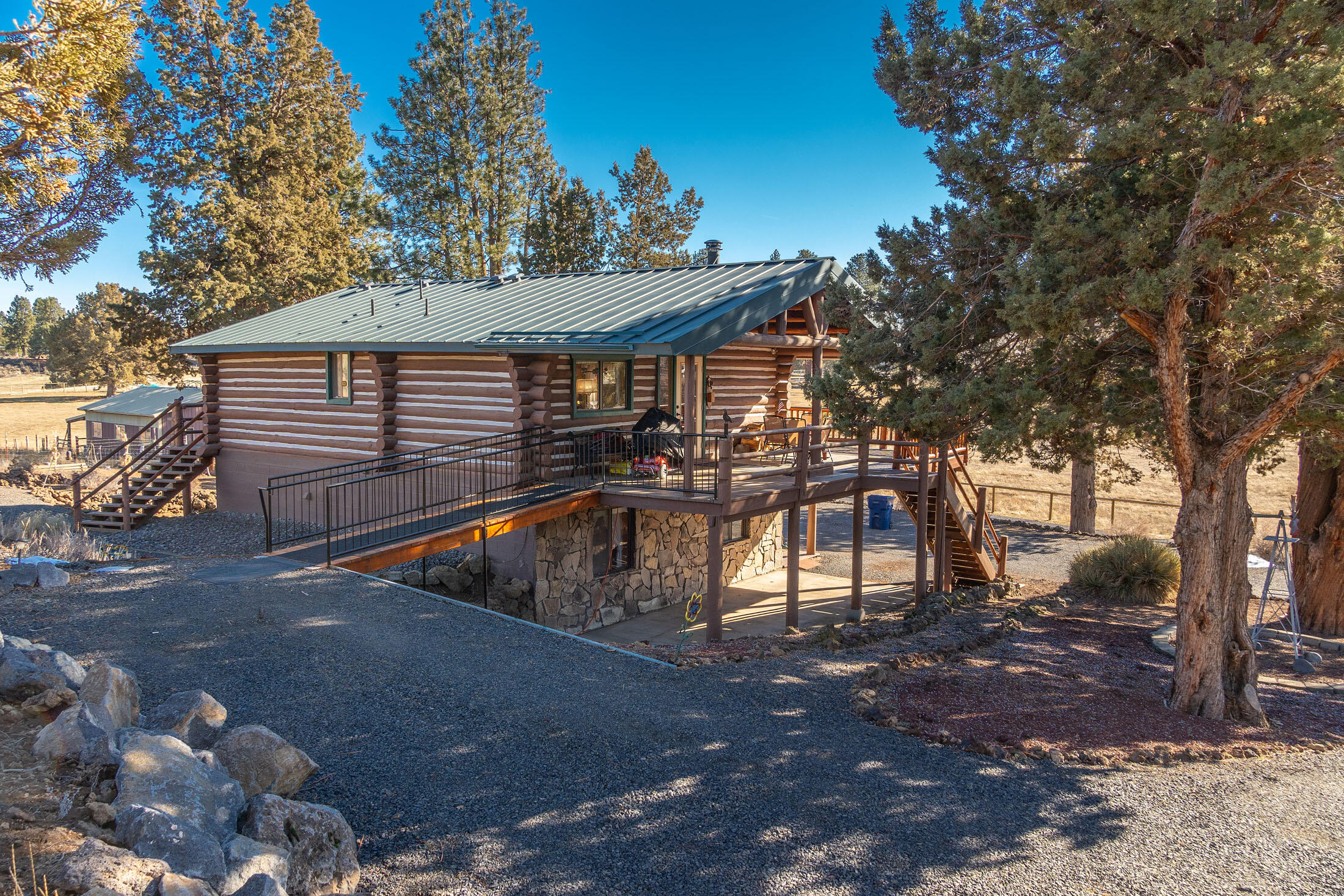 60384 Arnold Market Road Bend, OR 97702 - Photo 35 of 93 a view of a house with large trees