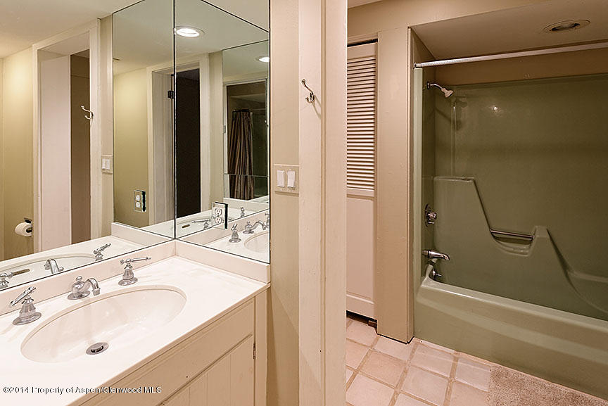 47 North Ridge Lane, Unit B Snowmass Village, CO 81615 - Photo 12 of 18 a bathroom with a sink and a mirror