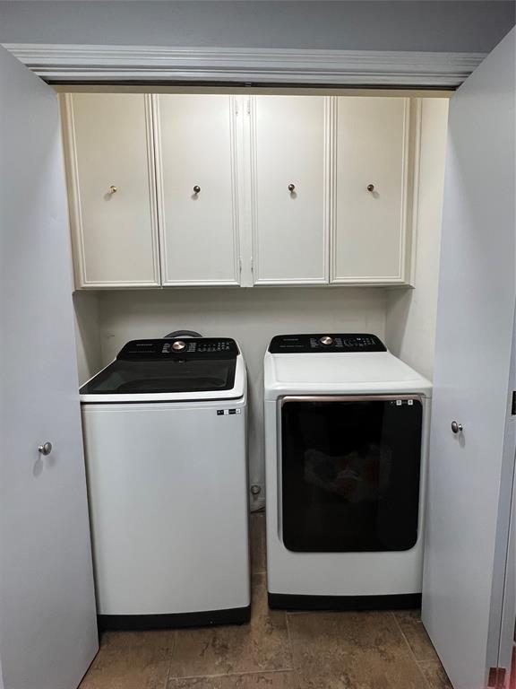 3802 Chisholm Trail Temple, TX 76504 - Photo 11 of 23 a utility room with stainless steel appliances white cabinets and a stove top oven