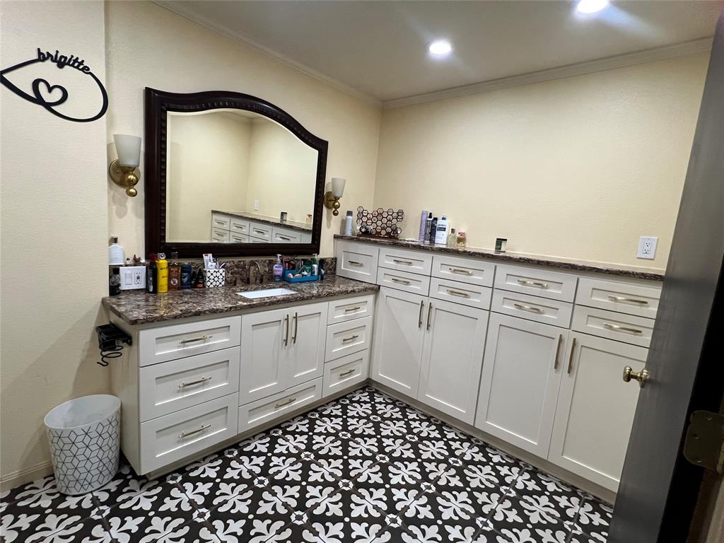 3802 Chisholm Trail Temple, TX 76504 - Photo 14 of 23 a kitchen with a sink and cabinets