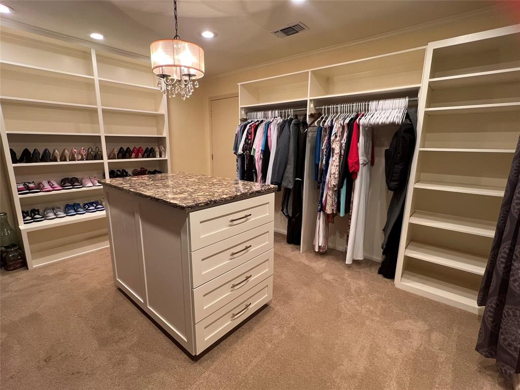 3802 Chisholm Trail Temple, TX 76504 - Photo 18 of 23 a view of walk in closet with clothes and shoes
