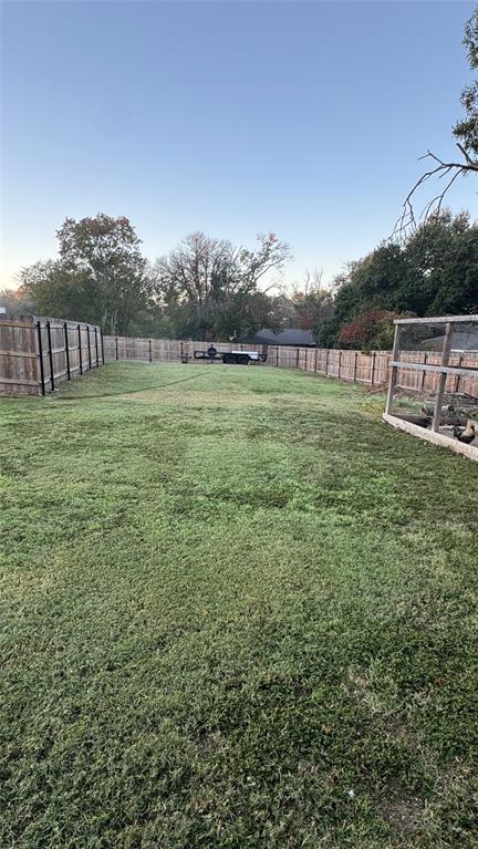 3802 Chisholm Trail Temple, TX 76504 - Photo 23 of 23 a view of a green field with wooden fence