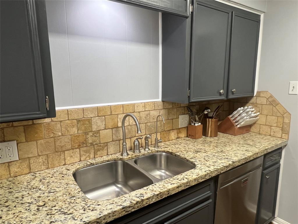 3802 Chisholm Trail Temple, TX 76504 - Photo 8 of 23 a view of a kitchen counter space a sink and dishwasher