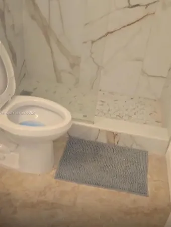 a bathroom with a toilet a sink and a bathtub