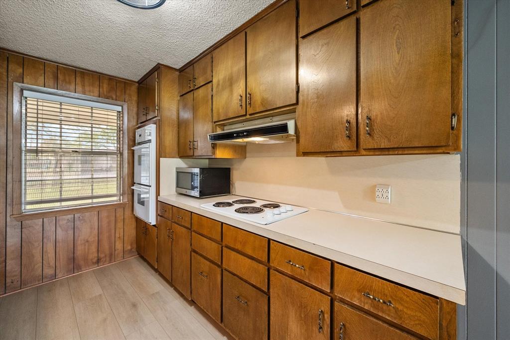 536 Robindale Lane Fairfield, TX 75840 - Photo 16 of 38 a kitchen with stainless steel appliances granite countertop a sink stove and cabinets