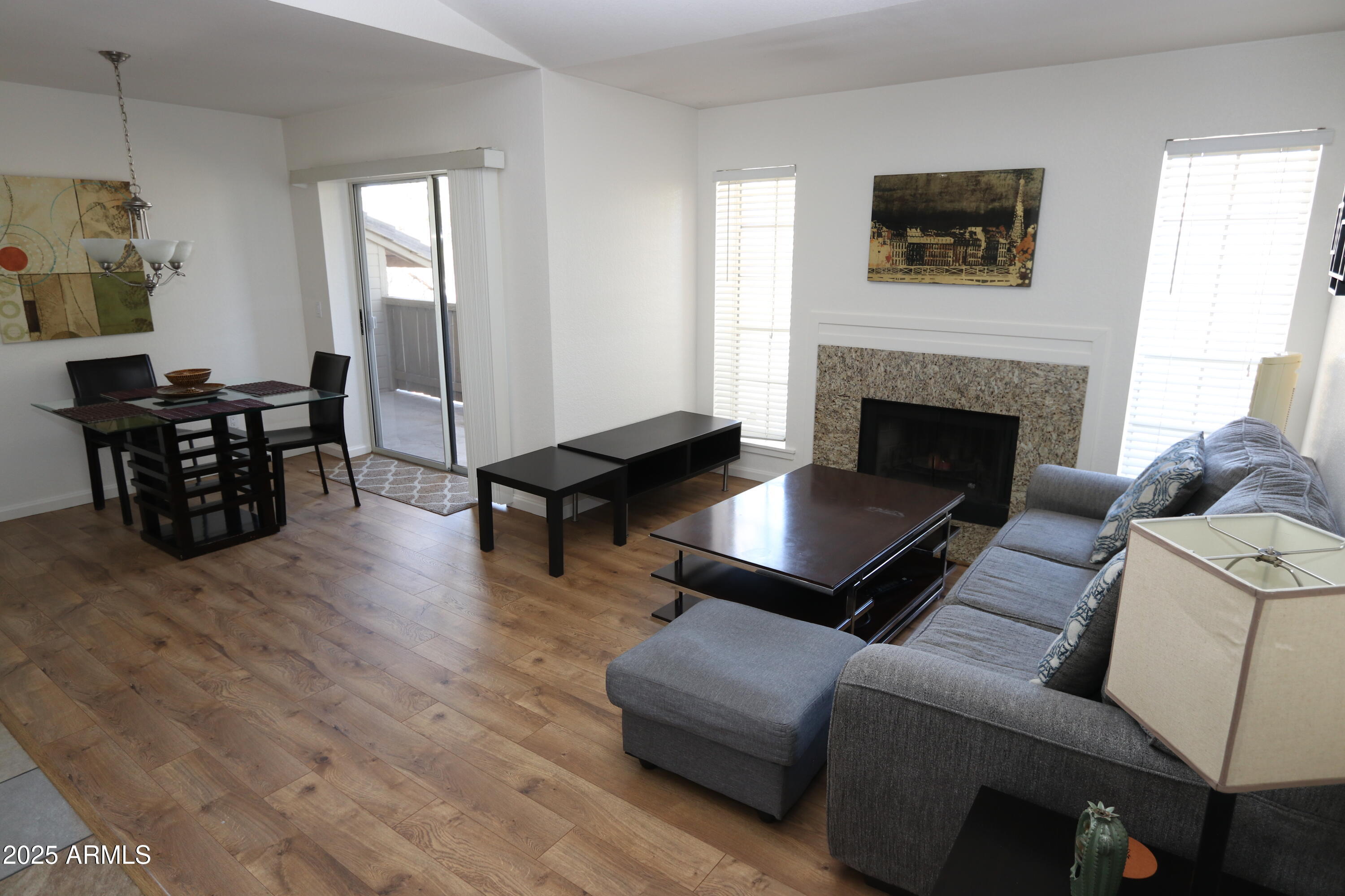 200 East Southern Avenue, Unit 307 Tempe, AZ 85282 - Photo 11 of 16 a living room with furniture fireplace and window